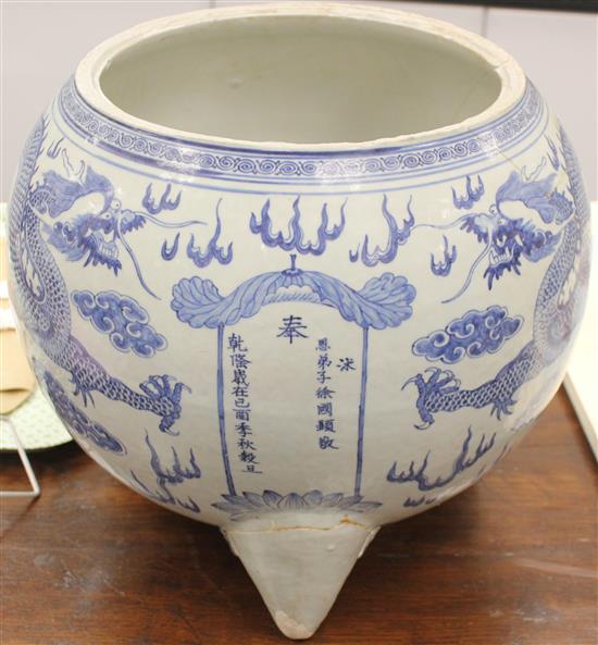 A massive Chinese blue and white dragon tripod censer, Qianlong mark and of the period (1736-95)